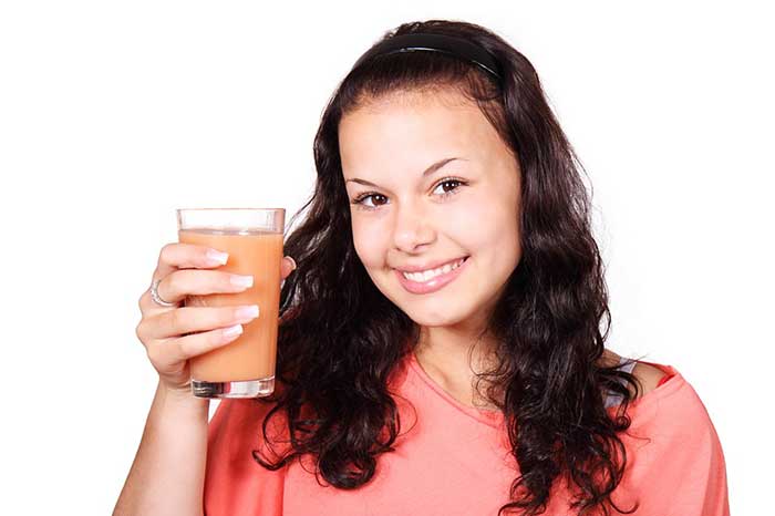 Girl holding a smoothie