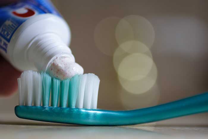 toothpaste on brush