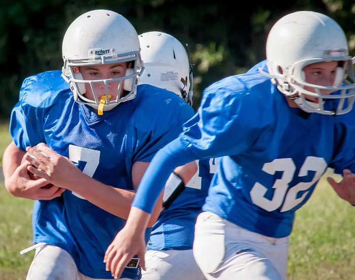 Boy playing rugby